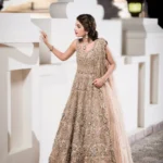 Opulent Gold Net Frock with Peach Embellishments