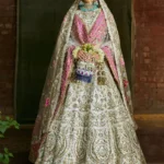 Pearl White Raw Silk Bridal Lehenga Choli with Antique Gold Embellishment