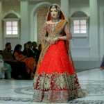 Majestic Scarlet Bridal Lehenga with Gold Zardozi & Crystal Embellishment