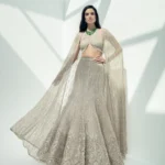 Glimmering Champagne Halter Lehenga with Sheer Cape